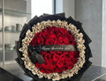 50 Red Roses with Leopard Accent